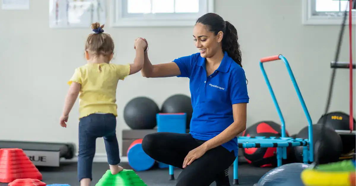 Dr Reeba PT providing pediatric physiotherapy in Lahore at home.